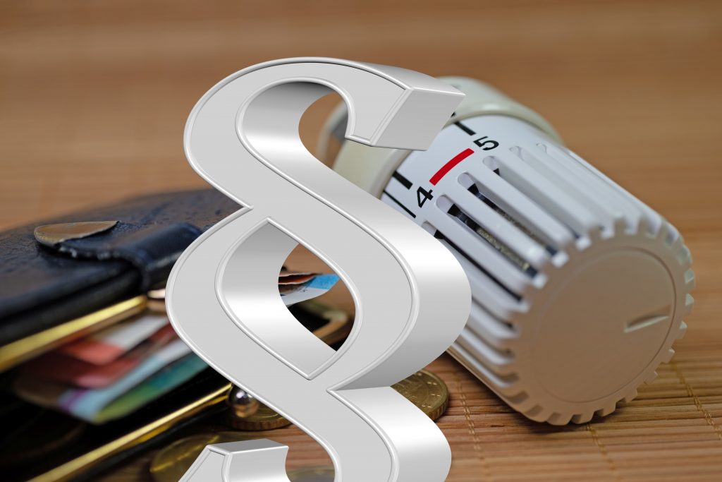 Heizkörperthermostat mit Paragraphenzeichen und Bezug zu Heizkostenverordnung und Gebäudeenergiegesetz