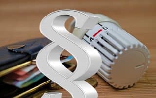 Heizkörperthermostat mit Paragraphenzeichen und Bezug zu Heizkostenverordnung und Gebäudeenergiegesetz